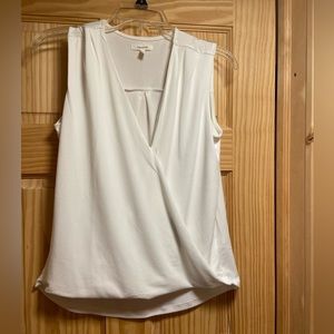 White dressy tank top. Super soft and stretchy with wrap detail. Size small